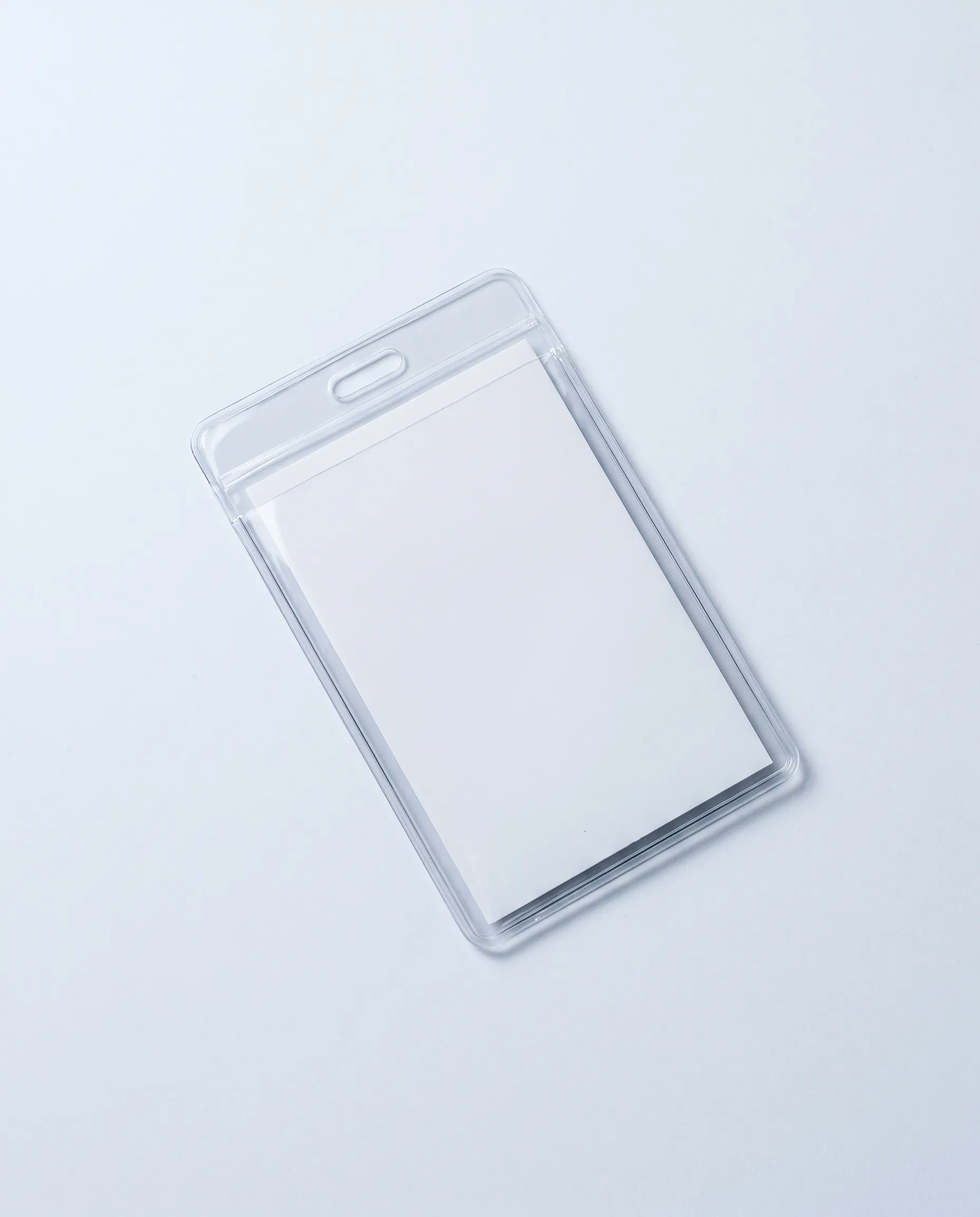 A clear PVC lanyard pouch in portrait orientation with a blank white insert, for a 105 × 150 mm insert.