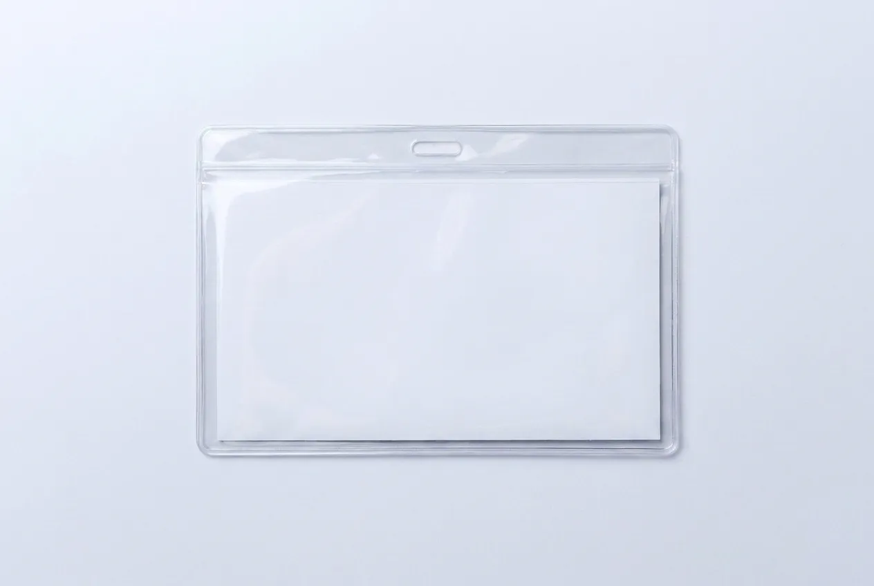 A wide landscape clear PVC lanyard pouch with a blank white insert, noticeably wider than it is tall.
